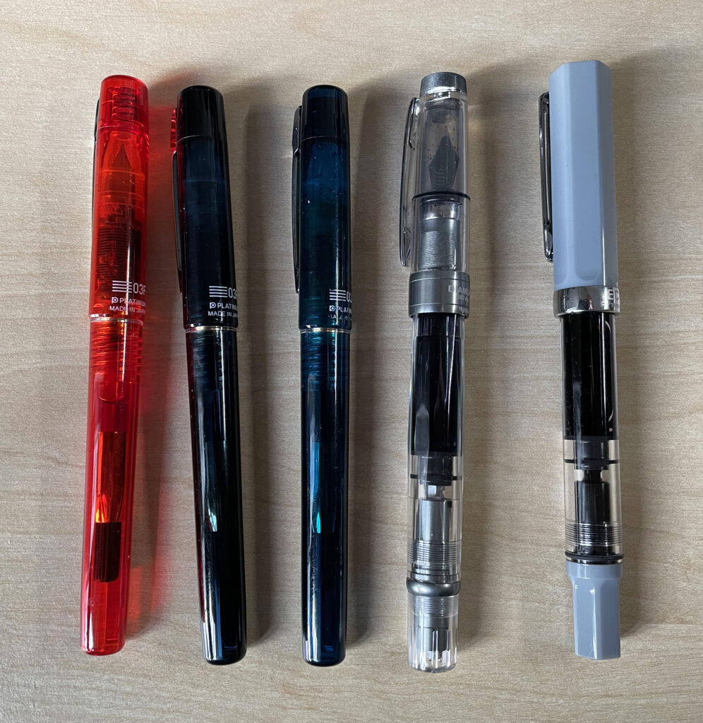 A picture showing five fountain pens.